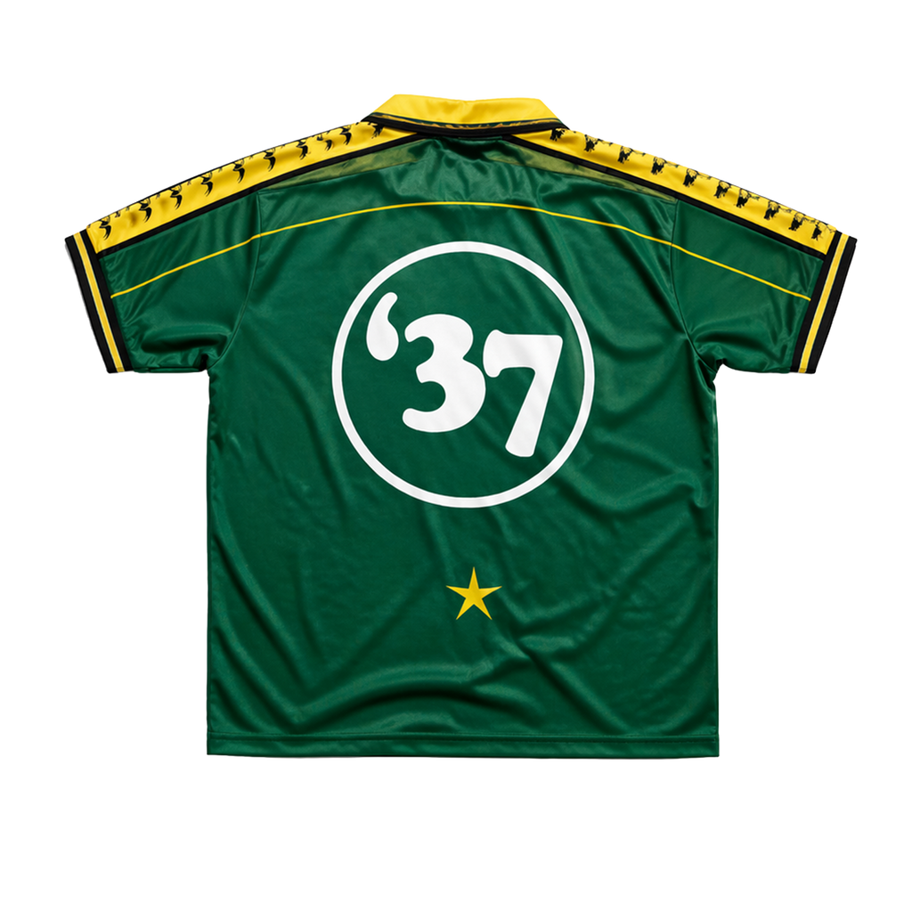 Green DMA'S sports jersey with number 37 and yellow accents.