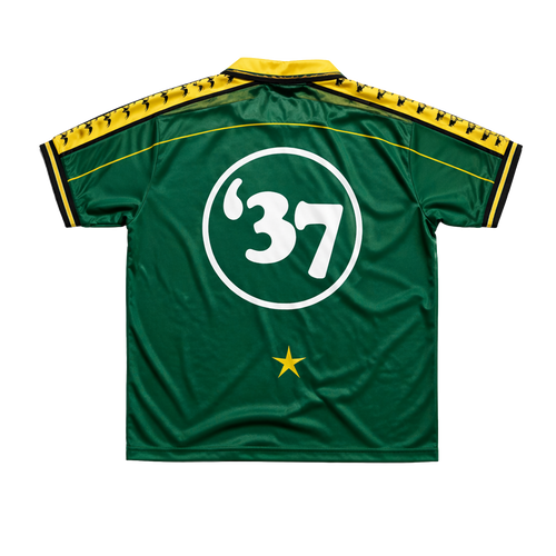 Green DMA'S sports jersey with number 37 and yellow accents.