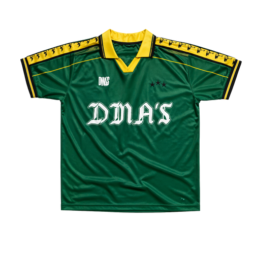 Green sports jersey with yellow accents and 'DMA'S' branding.