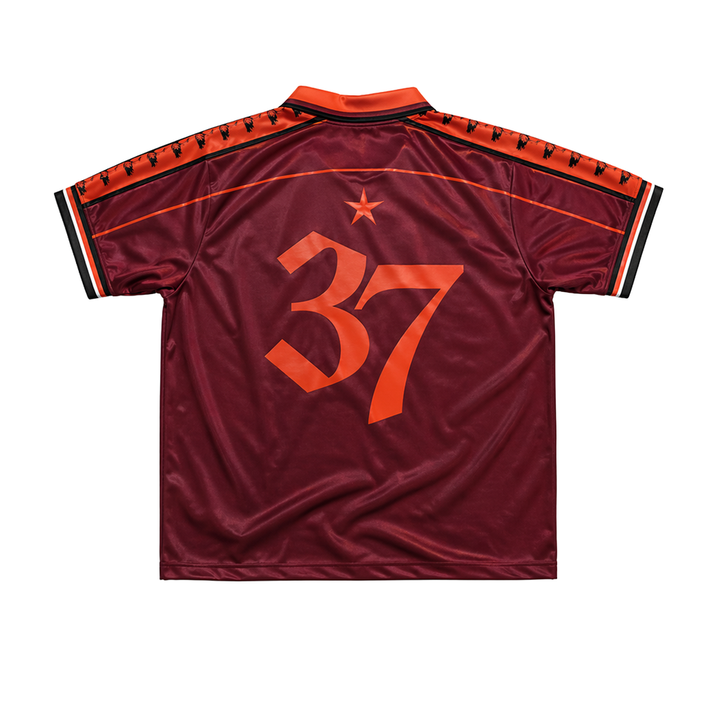 Maroon DMA'S sports jersey with orange number 37.