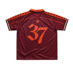 Maroon DMA'S sports jersey with orange number 37.
