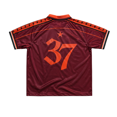 Maroon DMA'S sports jersey with orange number 37.